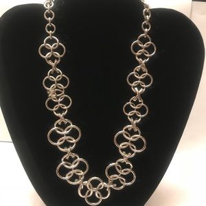 Silver chained and patterned necklace